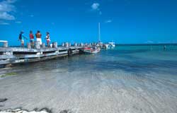 Puerto Morelos Villas | The pier in the center of Puerto Morelos hosts snorkel and sport fishing boats.