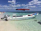 Private local boat for snorkeling and fishing excursion