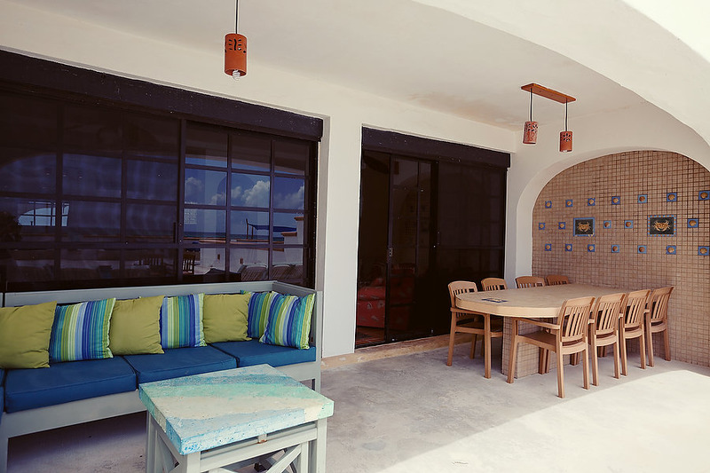 Puerto Morelos |Secret Beach Villas | Boat Villa |Outside Covered Patio Dining table and Sectional